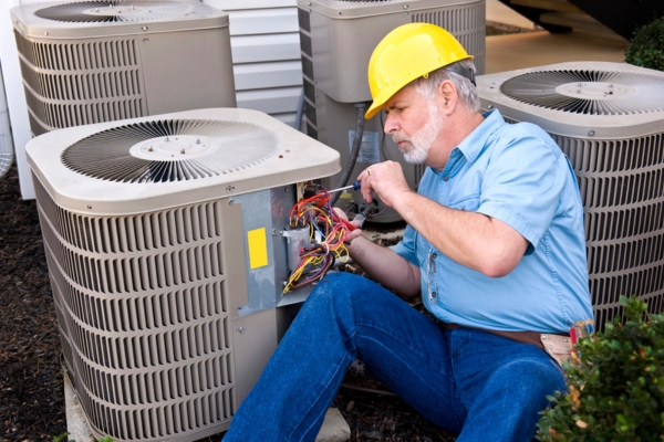 Air Conditioning Repairman At Work