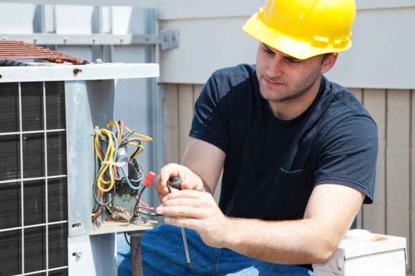 professional HVAC repairman depicting air conditioner repair