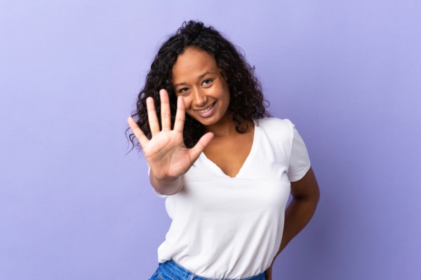 woman holding 5 fingers up depicting reasons to hire certified HVAC contractors