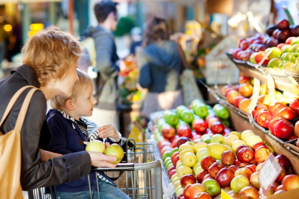 mother and daughter shopping for fruits