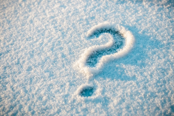 question mark written on snow depicting winter heating tips FAQs