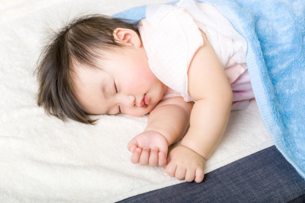 little baby sleeping soundly due to quiet ductless air conditioner