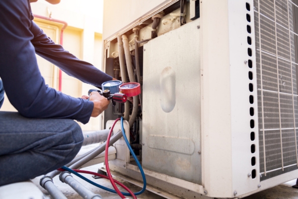 Professional HVAC technician depicting proper maintenance