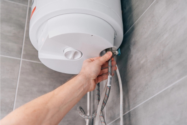 homeowner inspecting boiler depicting boiler efficiency