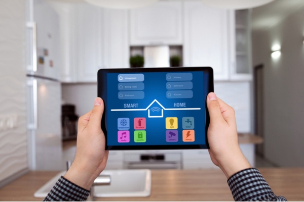 woman with smart home tablet controller depicting technological advancement