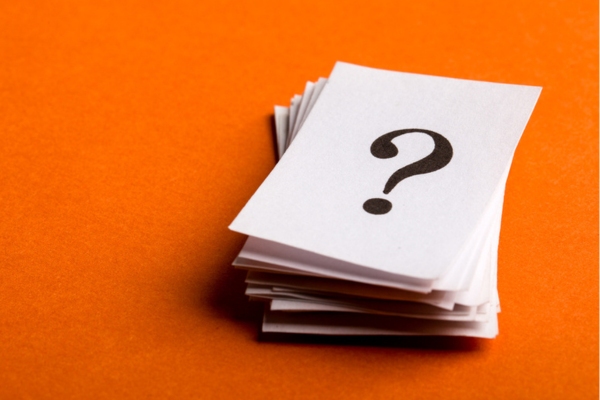 question mark printed on a stack of paper depicting boiler FAQs