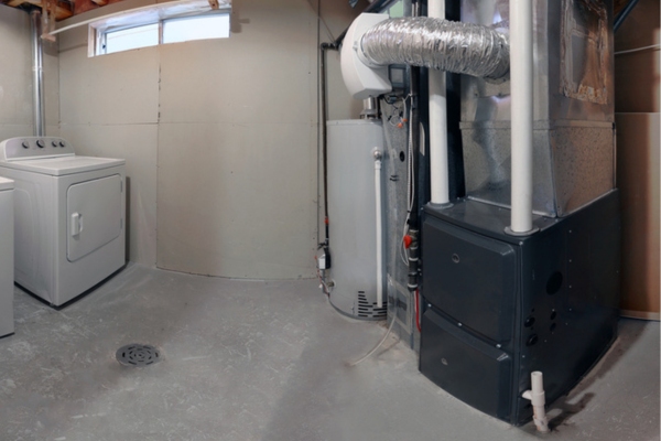 side view of a residential furnace in the laundry room