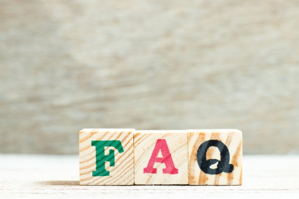 FAQ painted on wooden blocks depicting frequently asked questions about oil delivery