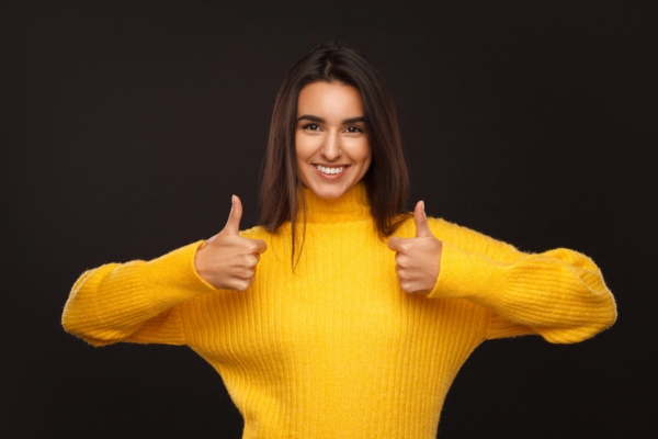 woman holding two thumbs up depicting best option for fuel delivery