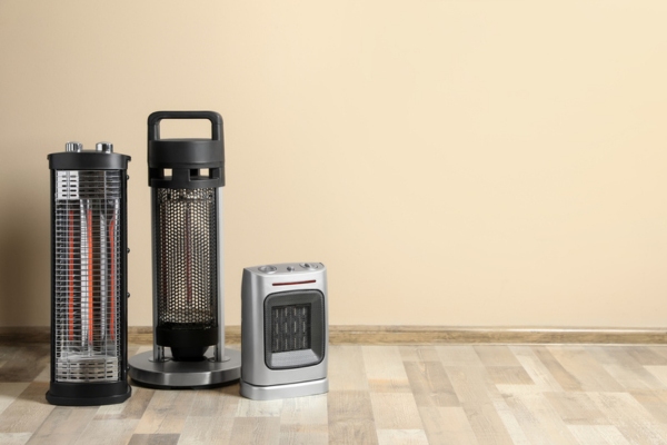 different types of electric space heaters on the floor