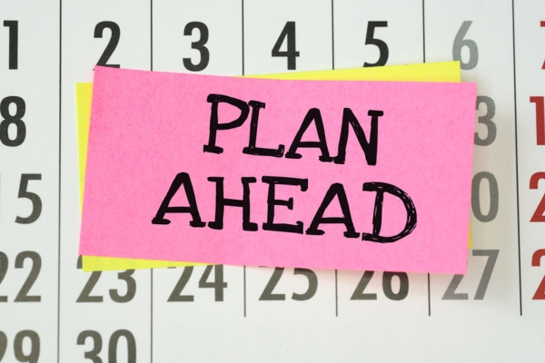 plan ahead sticky note on a calendar depicting oil delivery