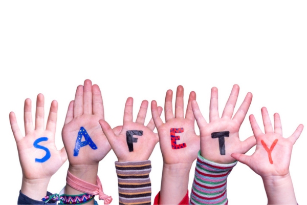 safety painted on kids hands depicting oil heat safety precautions