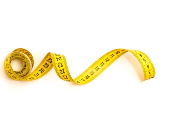 yellow tape measure depicting generator sizing