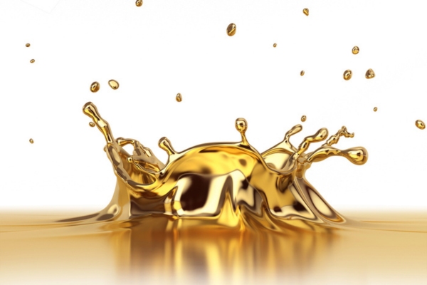 a splash of gold liquid depicting refining costs of heating oil